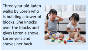 Toddler girls sitting on floor with blocks, one of the girls is crying.