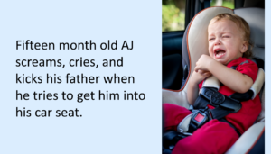 Toddler boy in car seat crying